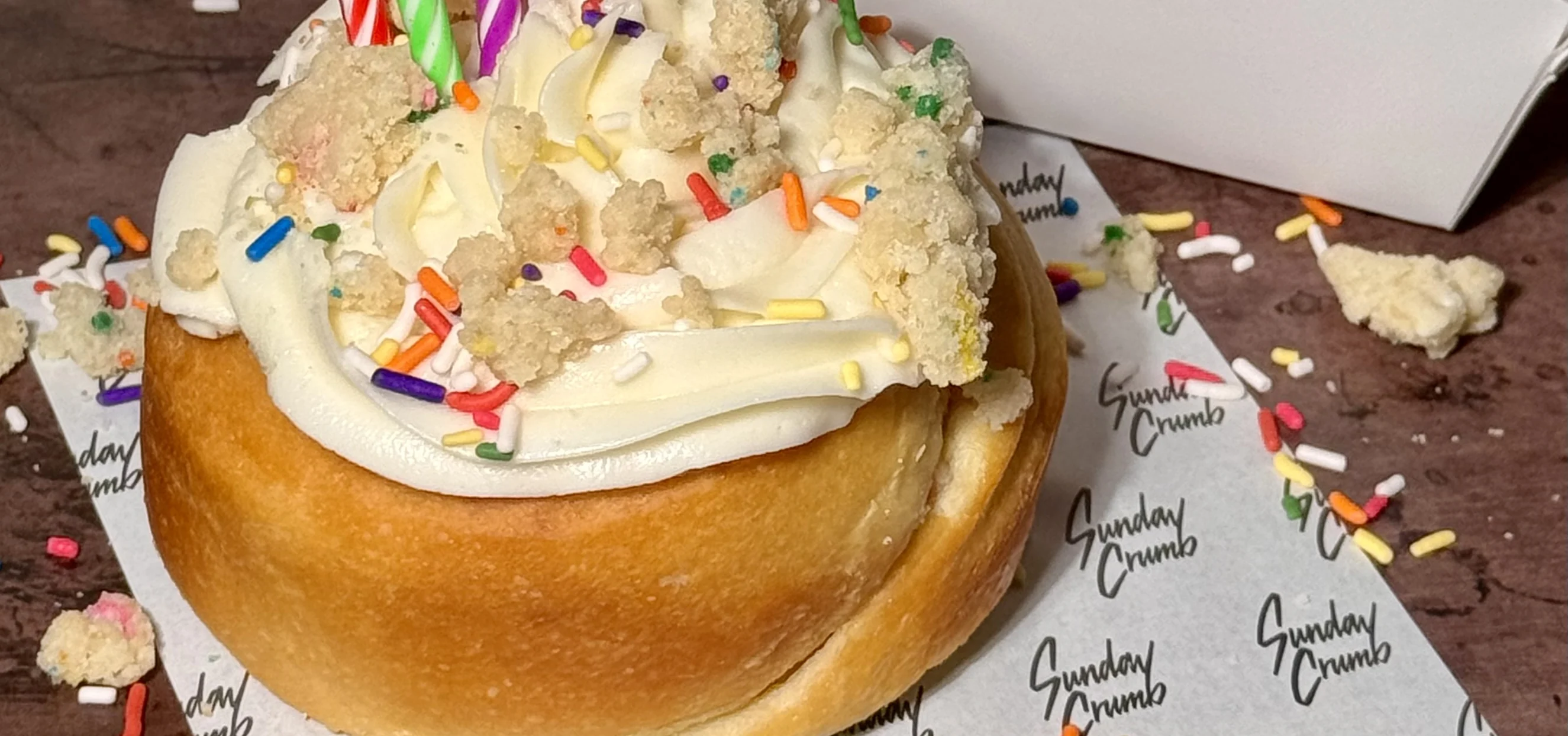 A real Sunday Crumb bake, cinnamon rolls with sprinkles and frosting